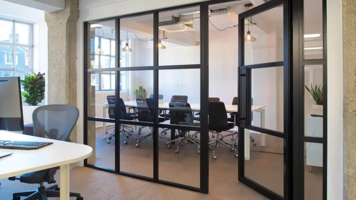 Large office space with glass wall partitions